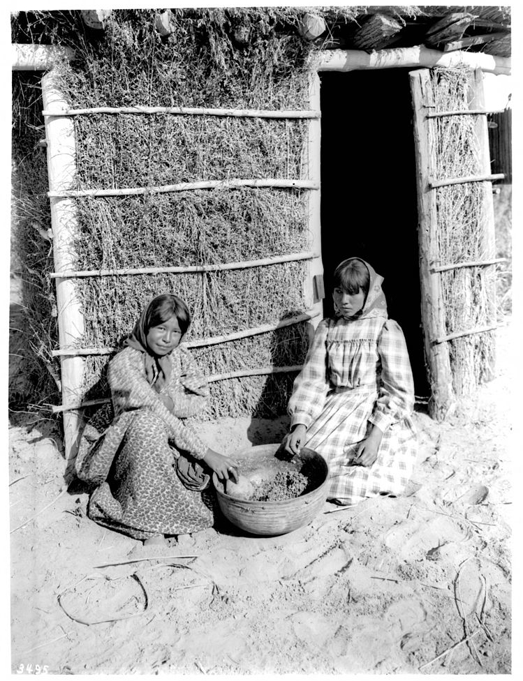 A beer made from carob seeds prepared by two Chemehuevi girls around 1900.